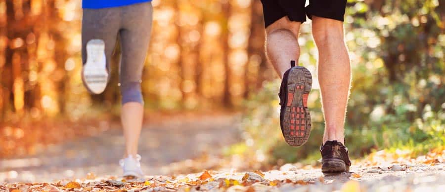 people running in the woods