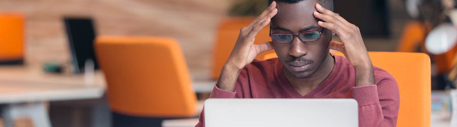 man looks for treatment on computer