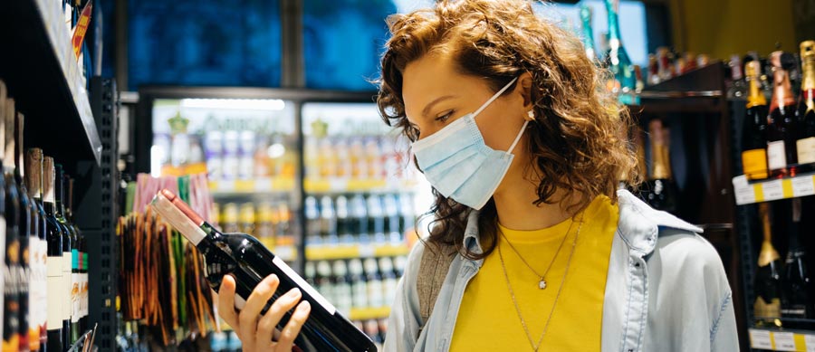 woman buys alcohol during the pandemic