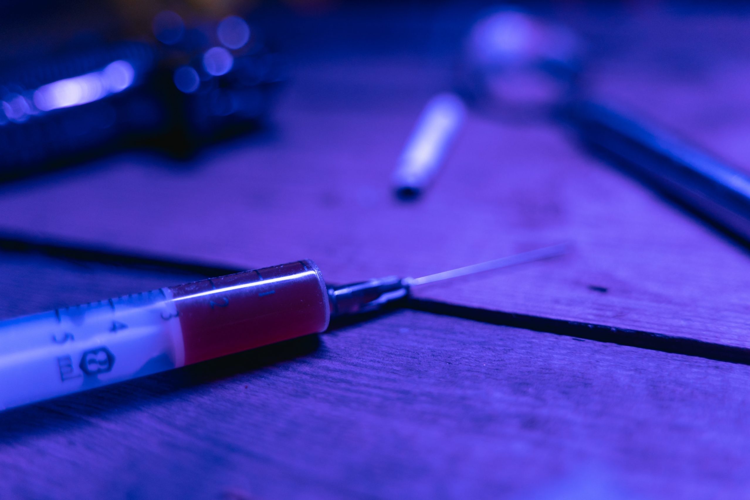 Syringe and spoon with heroin